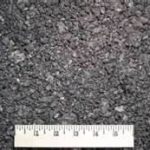 close up of asphalt with a ruler
